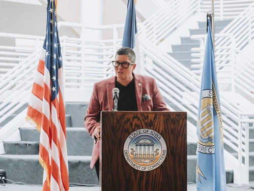 Director Skinner standing at the podium