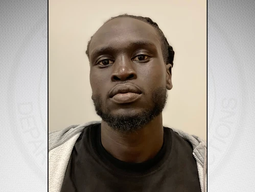Headshot of Chamdual in front of a gray background