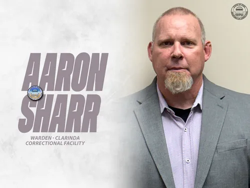 Sharr in front of a tan background next to the words "Aaron Sharr, Warden, Clarinda Correctional Facility"