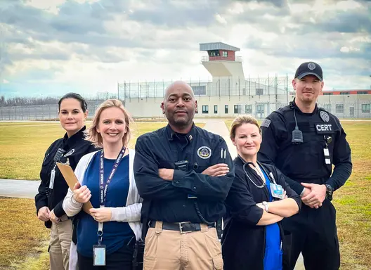 Photo of staff in front of the Iowa State Penitentiary including security, medical and treatment staff  