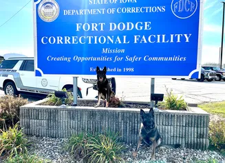 K9s Otto and Tank in front of the FDCF sign