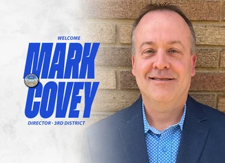 A headshot of Mark Covey next to the DOC Seal and the words Welcome Mark Covey, Director, 3rd District