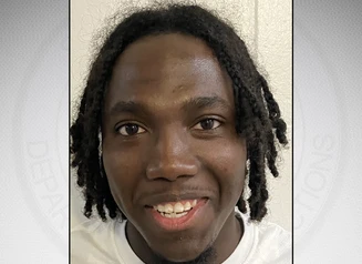 Orr in front of a gray background