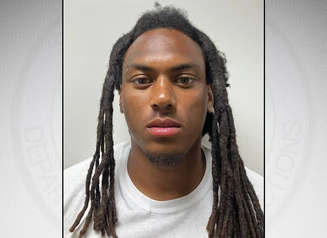 McGee in front of a gray background