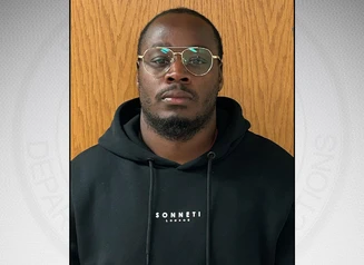 Harris in front of a gray background