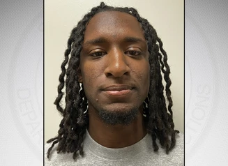 Beard Jr. in front of a gray background